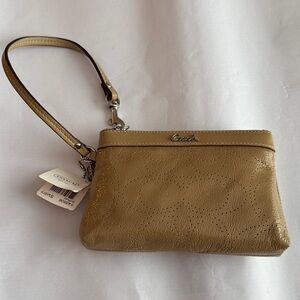 New with tags! Coach Patent Leather Nude Wristlet with Signature Pattern